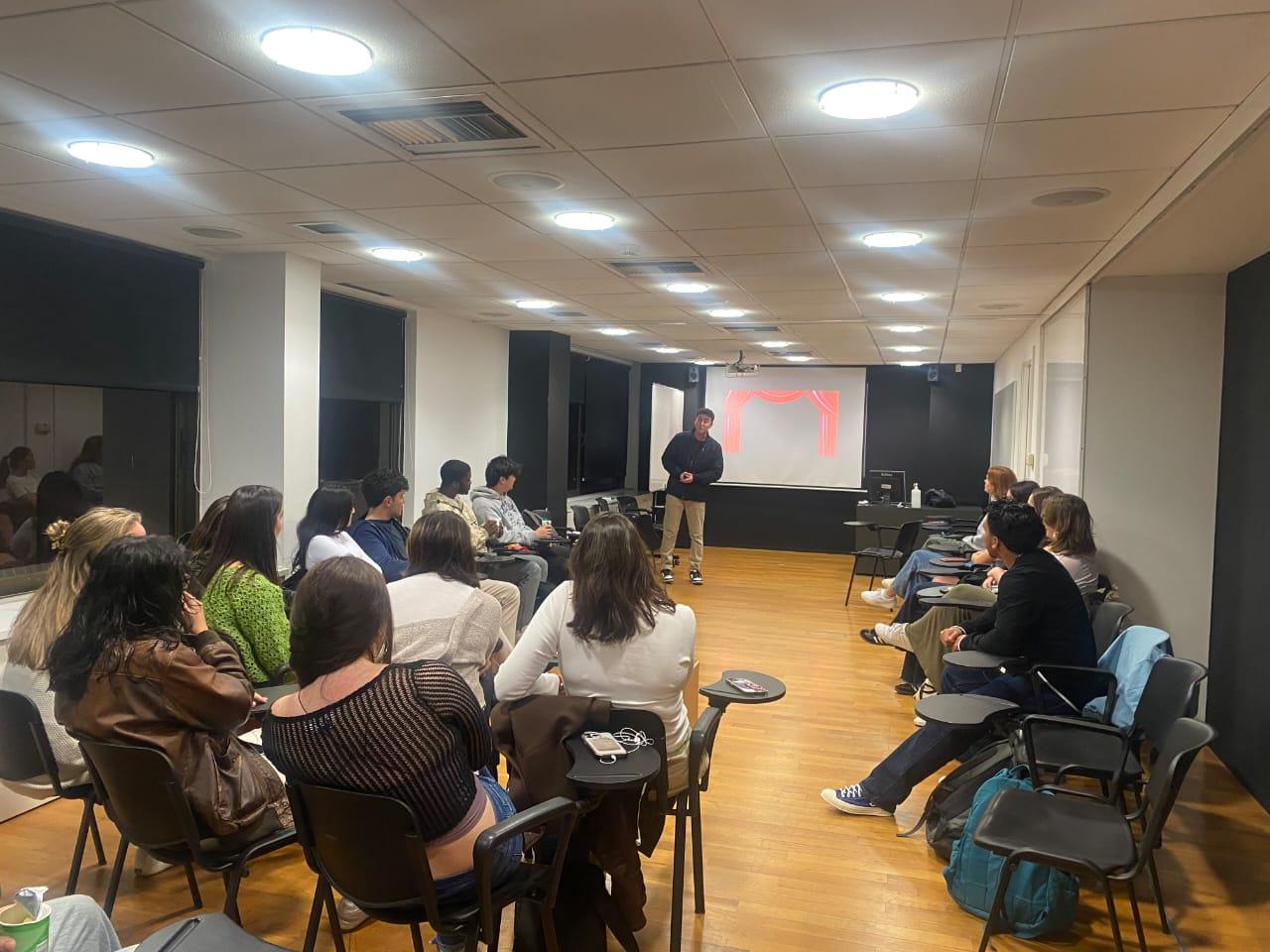 Tyler Gibgot teaching his psychology of magic course to a room of students in Athens, Greece.