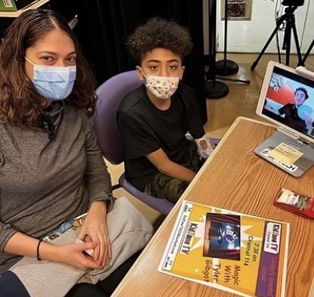 A young patient and his mother at Mount Sinai watching Tyler perform magic remotely on a tablet through KidZone TV.