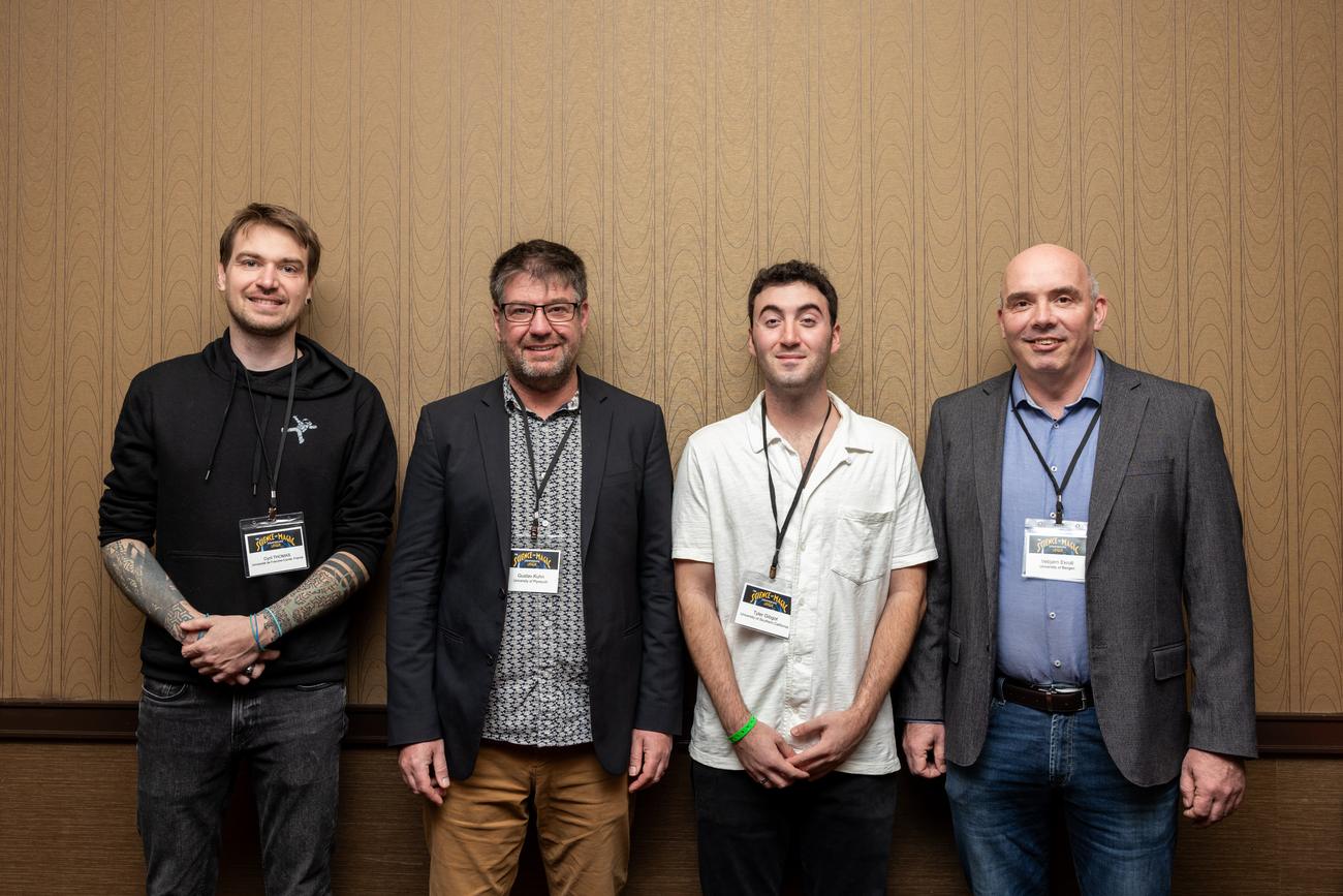 The four co-authors of Magic for the Blind standing together at the Science of Magic conference: Cyril Thomas, Gustav Kuhn, Tyler Gibgot, and Vebjorn Ekroll.